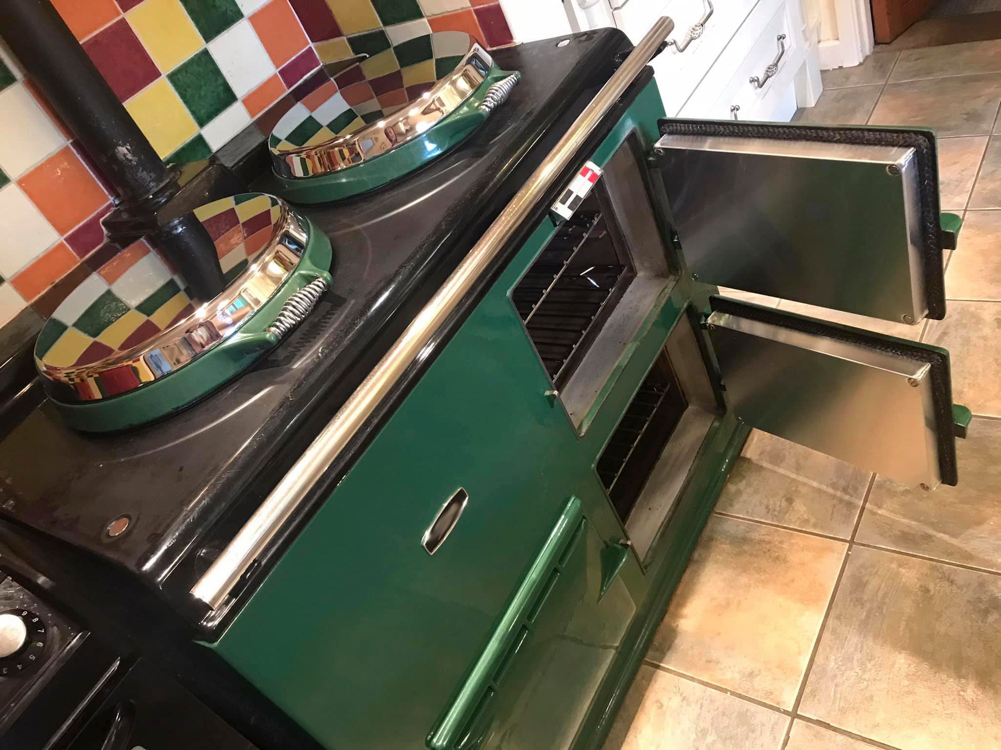 A British racing green Aga range cooker refurbished in Bath